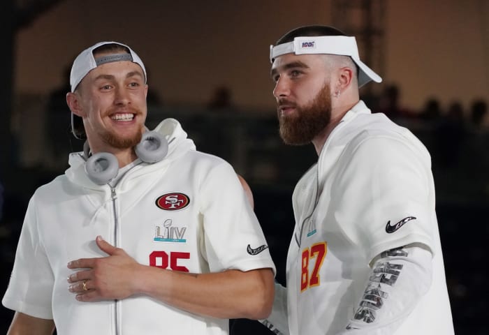 Jan 27, 2020; Miami, FL, USA; San Francisco 49ers tight end George Kittle (85) greets Kansas City Chiefs tight end Travis Kelce (87) during Super Bowl LIV Opening Night at Marlins Park. Mandatory Credit: Kirby Lee-USA TODAY Sports